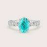 Oval "Paraiba" lab-grown diamond engagement ring in 18k white gold. Delicate diamond band.