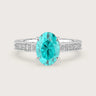 Oval Paraiba lab-grown engagement ring. Milgrain diamond band, 18k white gold. "R24821OVA" detail.