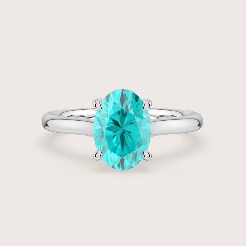 Oval "Paraiba" lab-grown diamond solitaire engagement ring in 18k white gold.