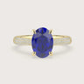 Oval lab-grown sapphire engagement ring. 18k yellow gold band with diamond accents. "R24827OVA.