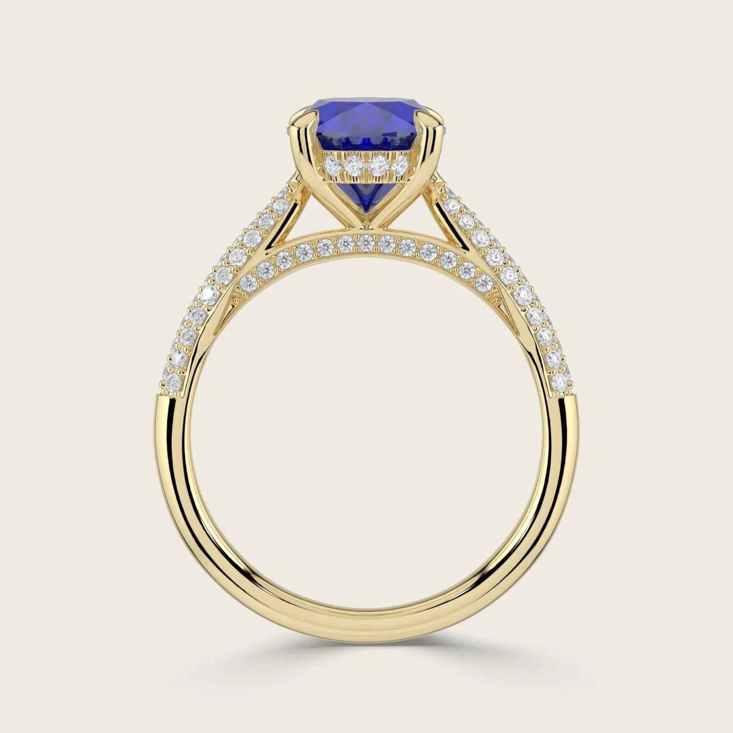 18k gold ring with oval lab-grown sapphire, "hidden halo" diamonds, and diamond band detail.