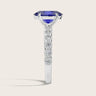 Lab-grown oval sapphire ring in 18k white gold with "milgrain" vintage diamond band, side view.