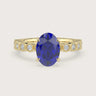 Oval lab-grown sapphire engagement ring. 18k yellow gold, vintage milgrain diamond band detail. "R24822OVA.