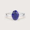 Oval lab-grown sapphire solitaire engagement ring in 18k white gold with milgrain detailing. "R24821OV.