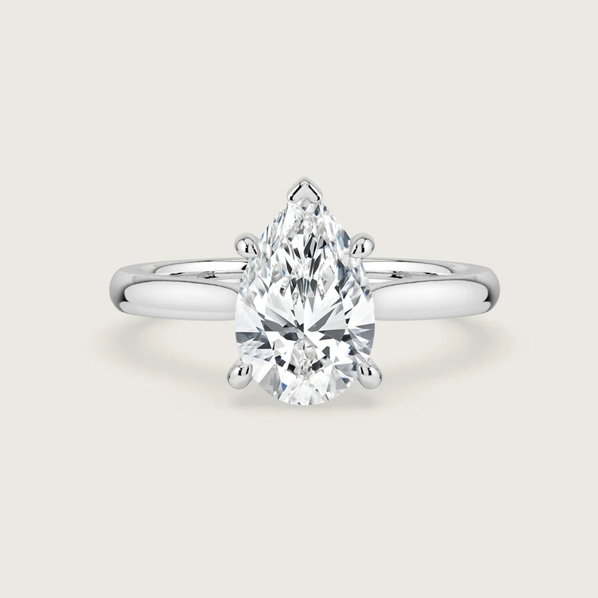 Pear-shaped lab-grown diamond solitaire engagement ring in 18k white gold.