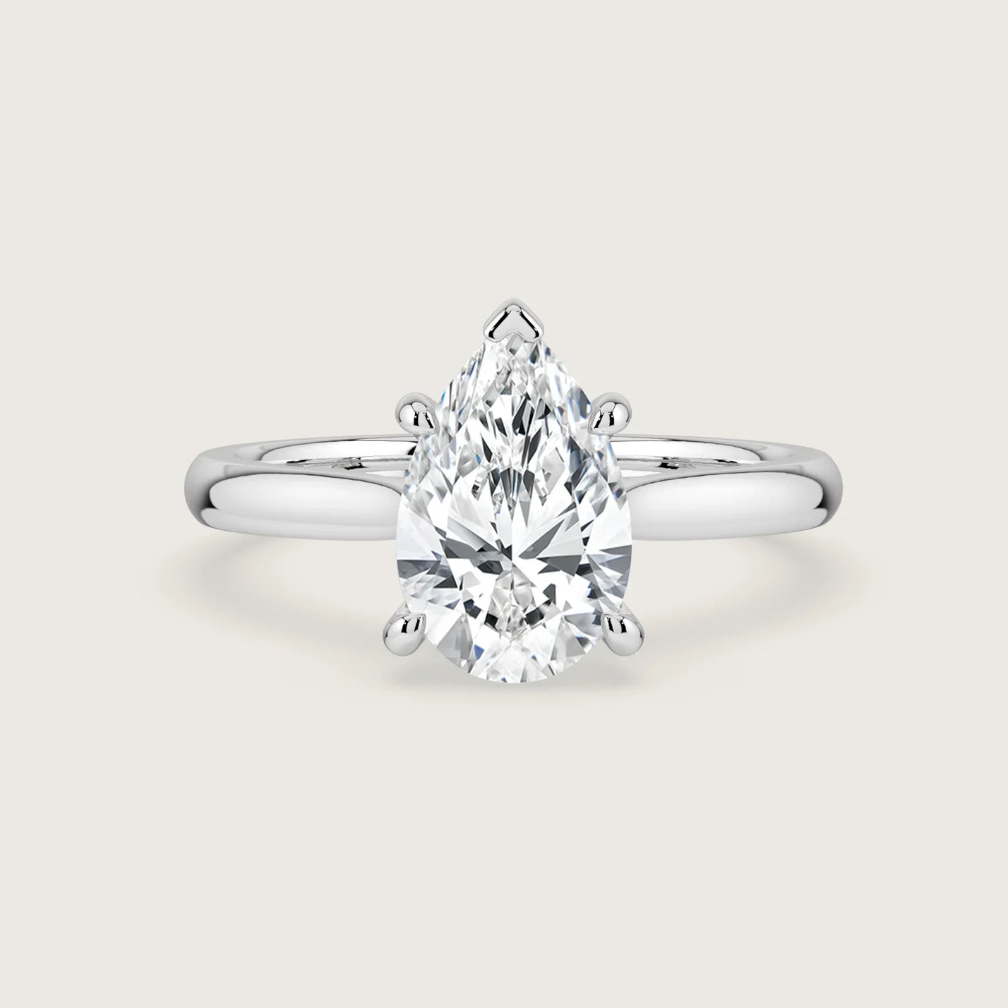Pear-shaped lab-grown diamond solitaire engagement ring in 18k white gold.