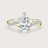 Lab-grown pear diamond engagement ring. 18k two-tone gold twist band with diamonds. "R24823PEA" detail.