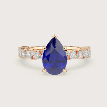 Rose gold engagement ring with pear-shaped lab-grown sapphire and diamond band. "R24830PEA.