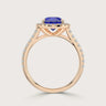 Rose gold ring with pear cut lab-grown sapphire, "halo" diamond setting, and diamond band.