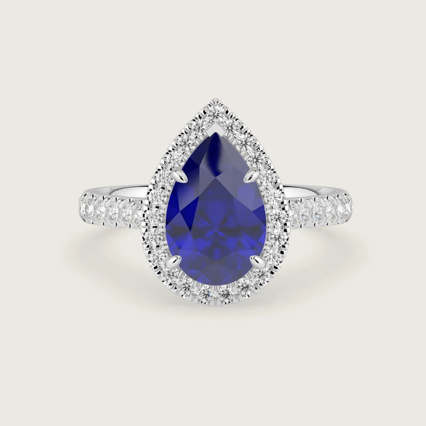 Pear-shaped lab-grown sapphire engagement ring with diamond halo and band in 18k white gold. "R24818PEHA.