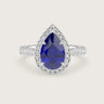 Pear-shaped lab-grown sapphire engagement ring with diamond halo and band in 18k white gold. "R24818PEHA.