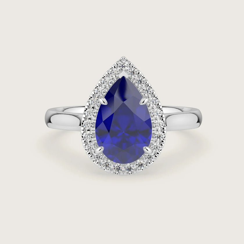 Lab-grown pear sapphire halo engagement ring in 18k white gold. "R24818PEH" design.