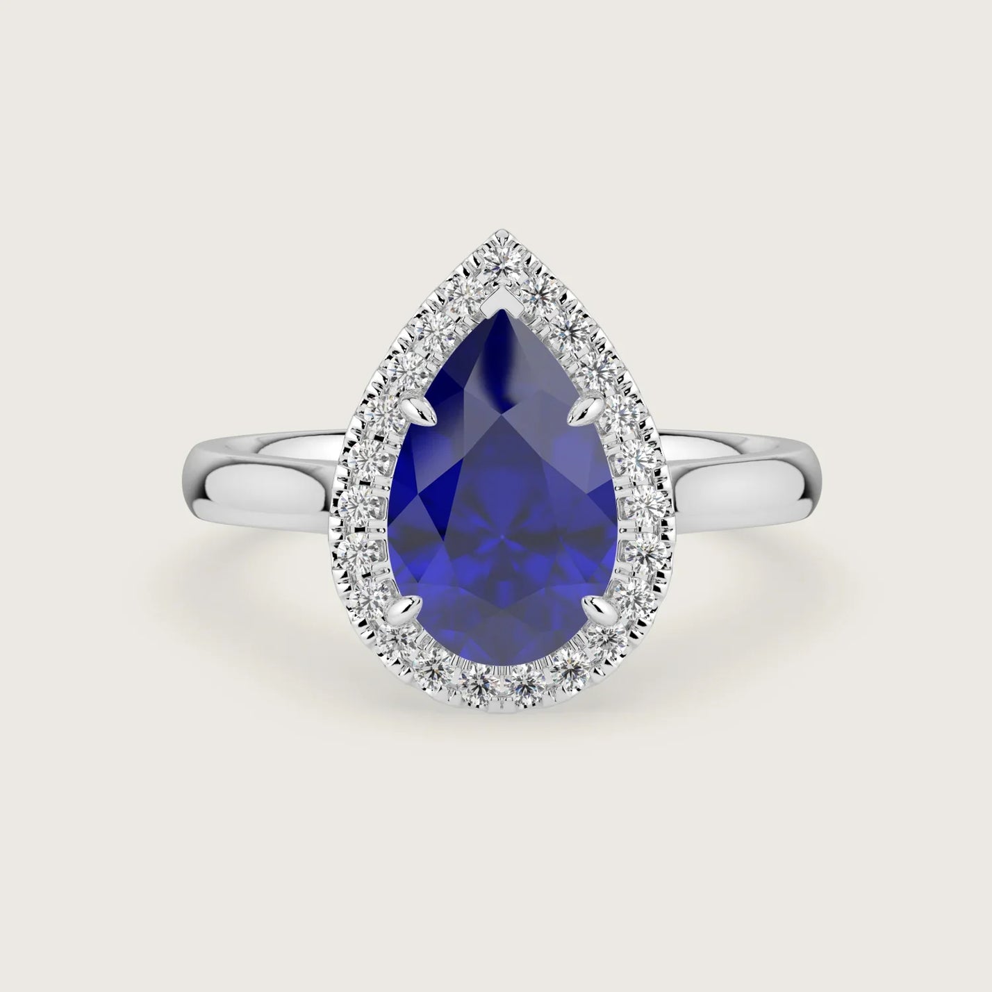 Lab-grown pear sapphire halo engagement ring in 18k white gold. "R24818PEH" design.